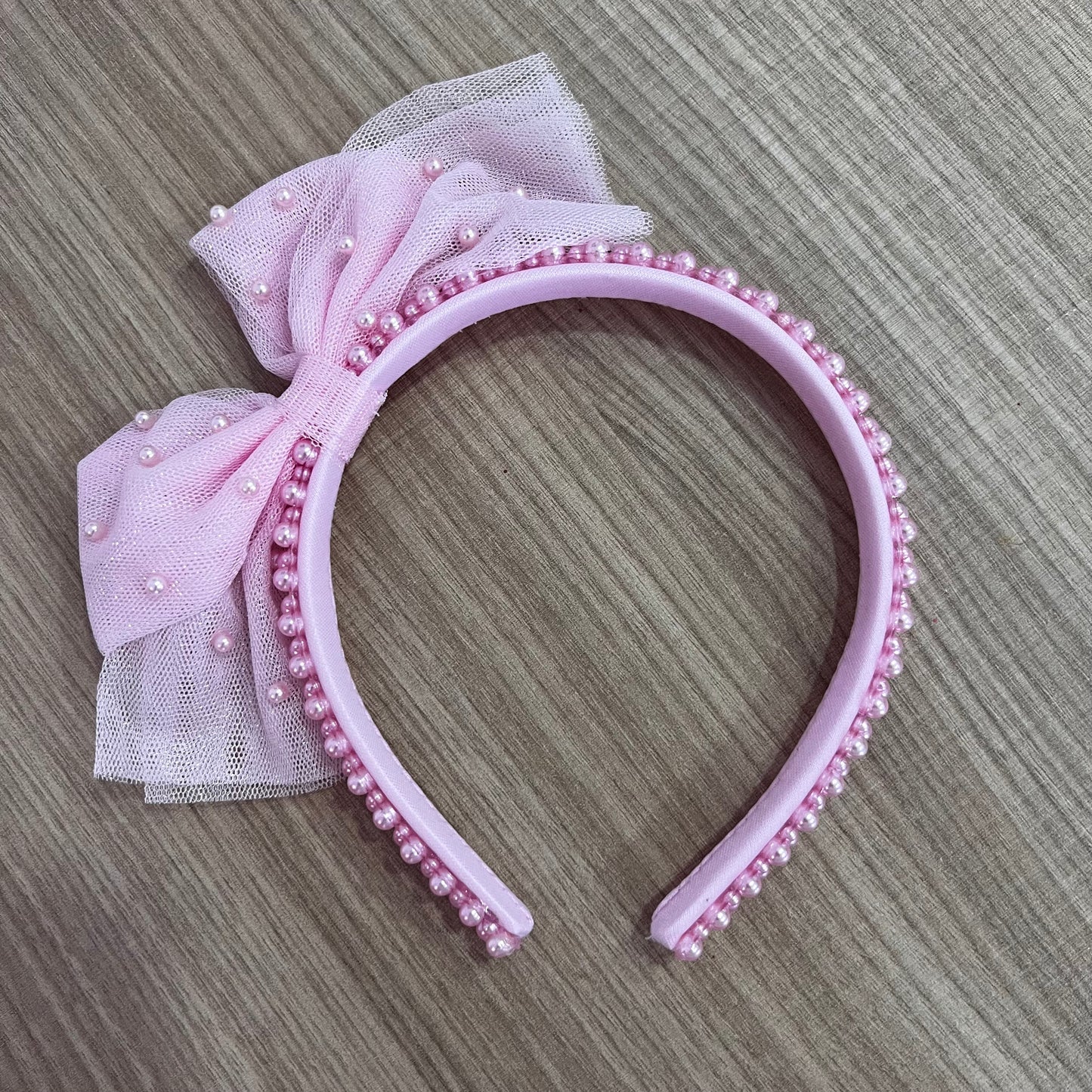 Diadema de perlas rosa